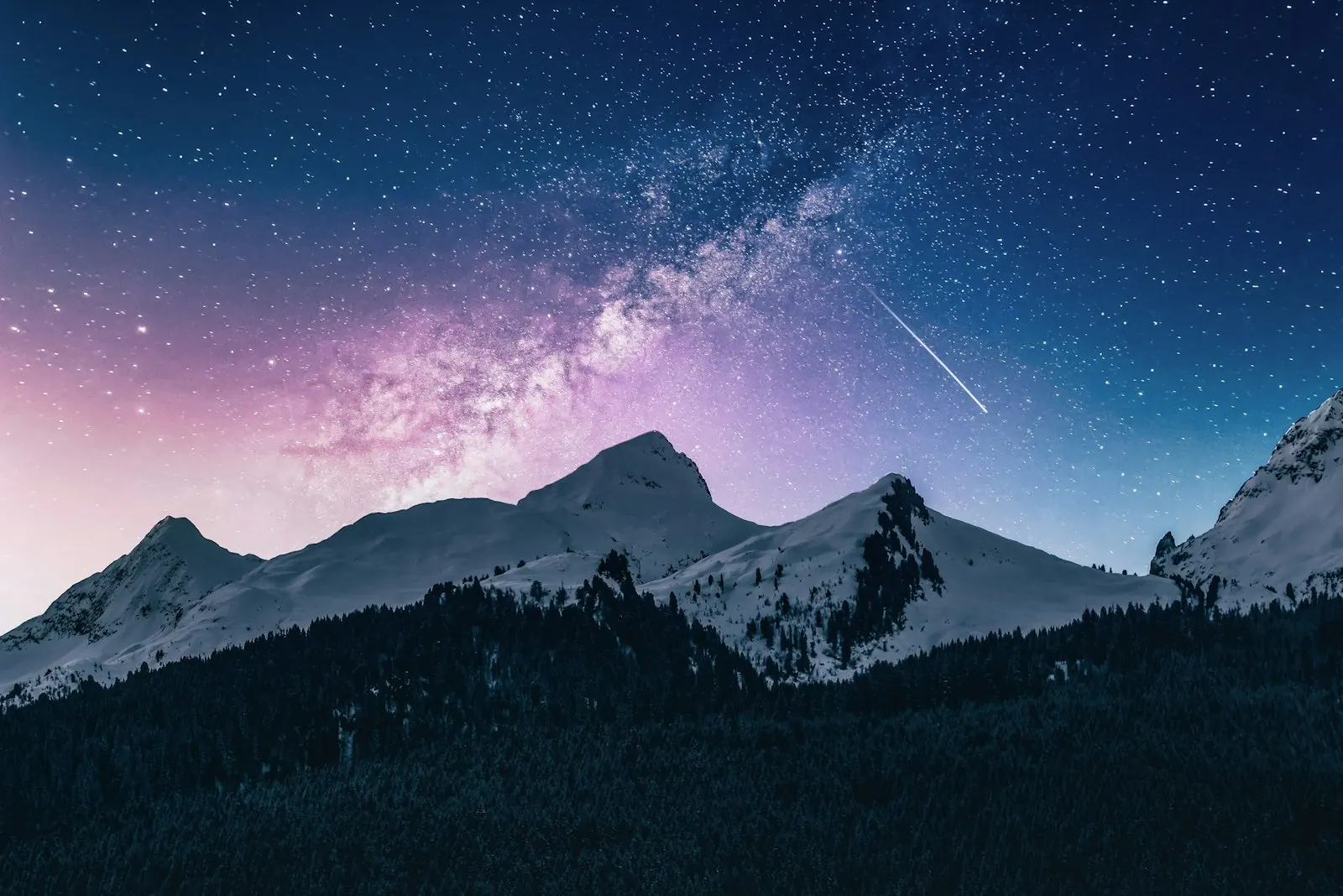 A mountain ridge under a sky full of stars
